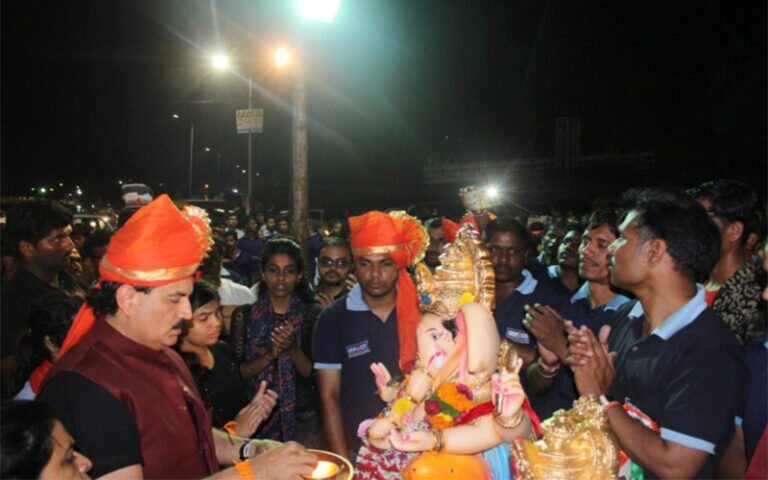 Spiritual Jitendra Joshi - offering prayers to Lord Ganesha Idol before immersion